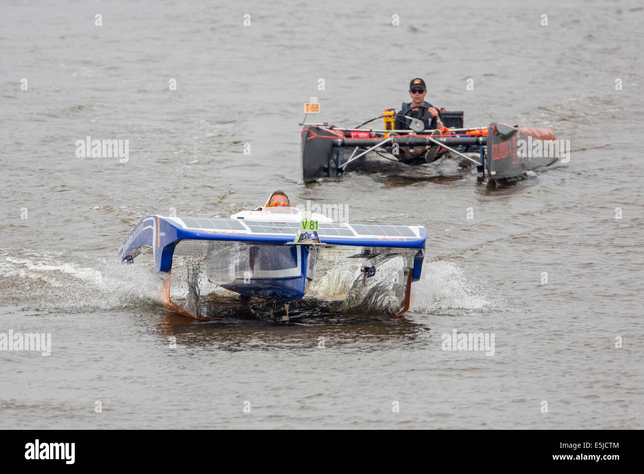 Netherlands, Franeker, DONG Solar Challenge 2014. Boat Race. World cup for solar powered boats. Dutch Navy Team and SDOG Team Stock Photo
