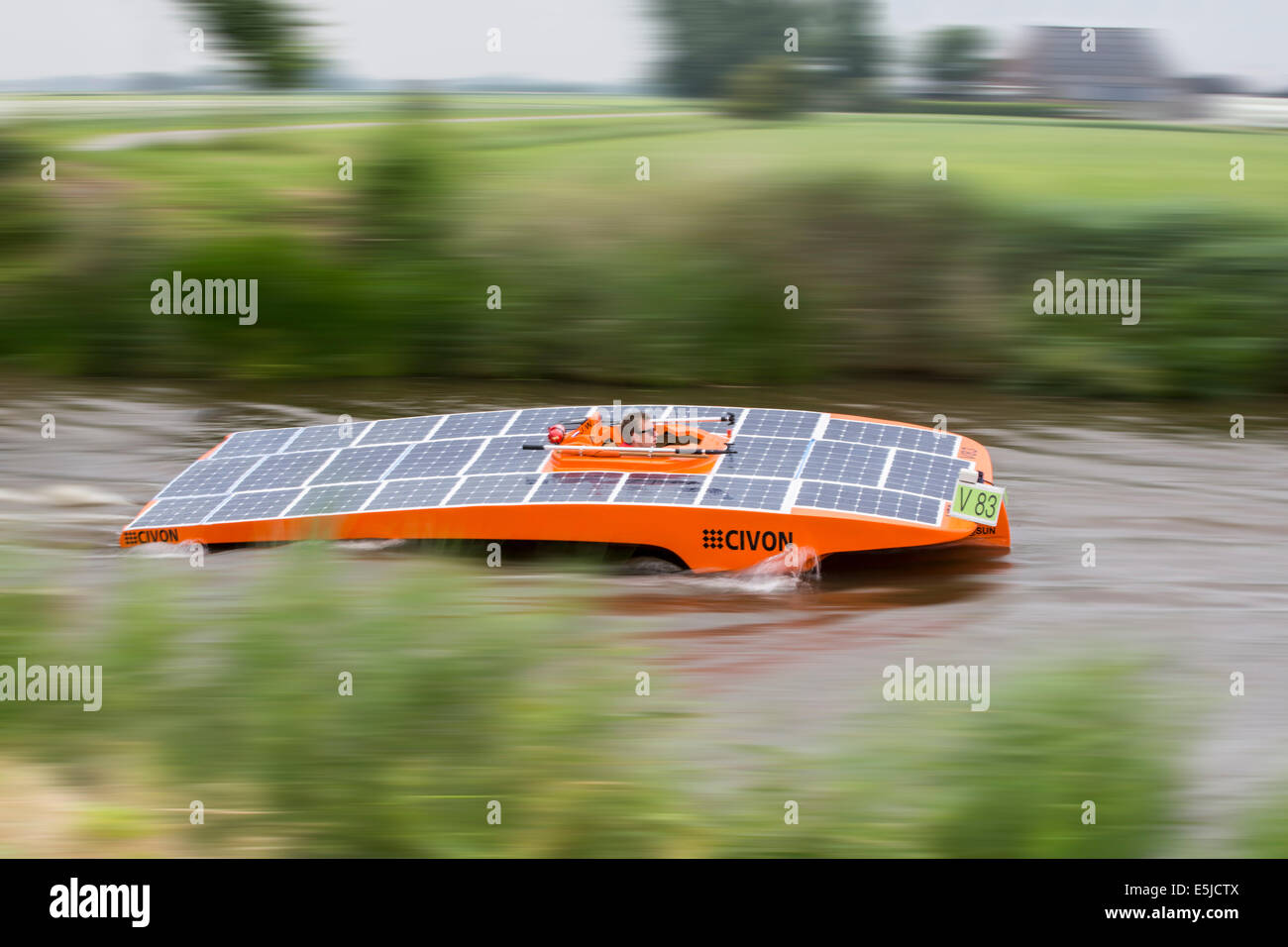 Netherlands, near Franeker, DONG Solar Challenge 2014. Boat Race. World cup for solar powered boats. Team Achterhoek Stock Photo