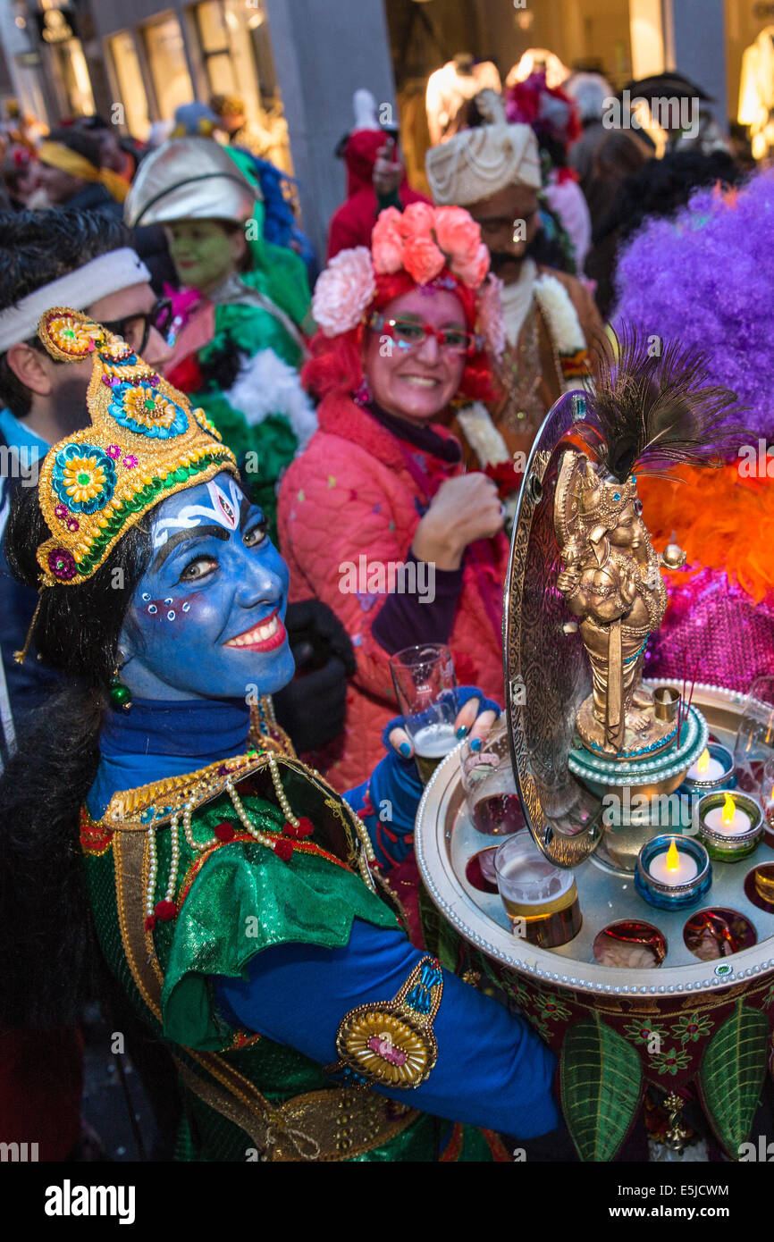 Netherlands, Maastricht, Carnival festival. Costumed people having a drink in the street. Disguised as SHAKTI, Hindu goddess Stock Photo