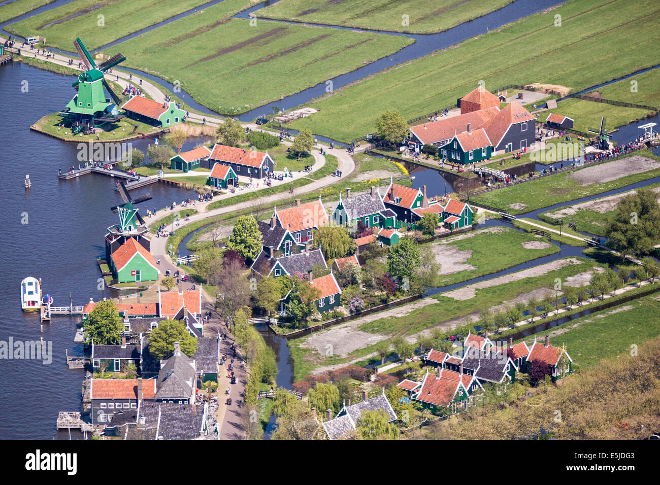 The Netherlands, Zaanse Schans. The outdoor museum has a collection of well-preserved historic windmills and houses. Aerial Stock Photo