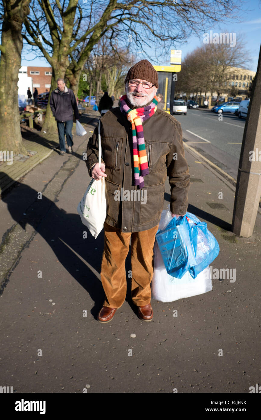 Shopper with brightly coloured rainbow winter scarf Stock Photo