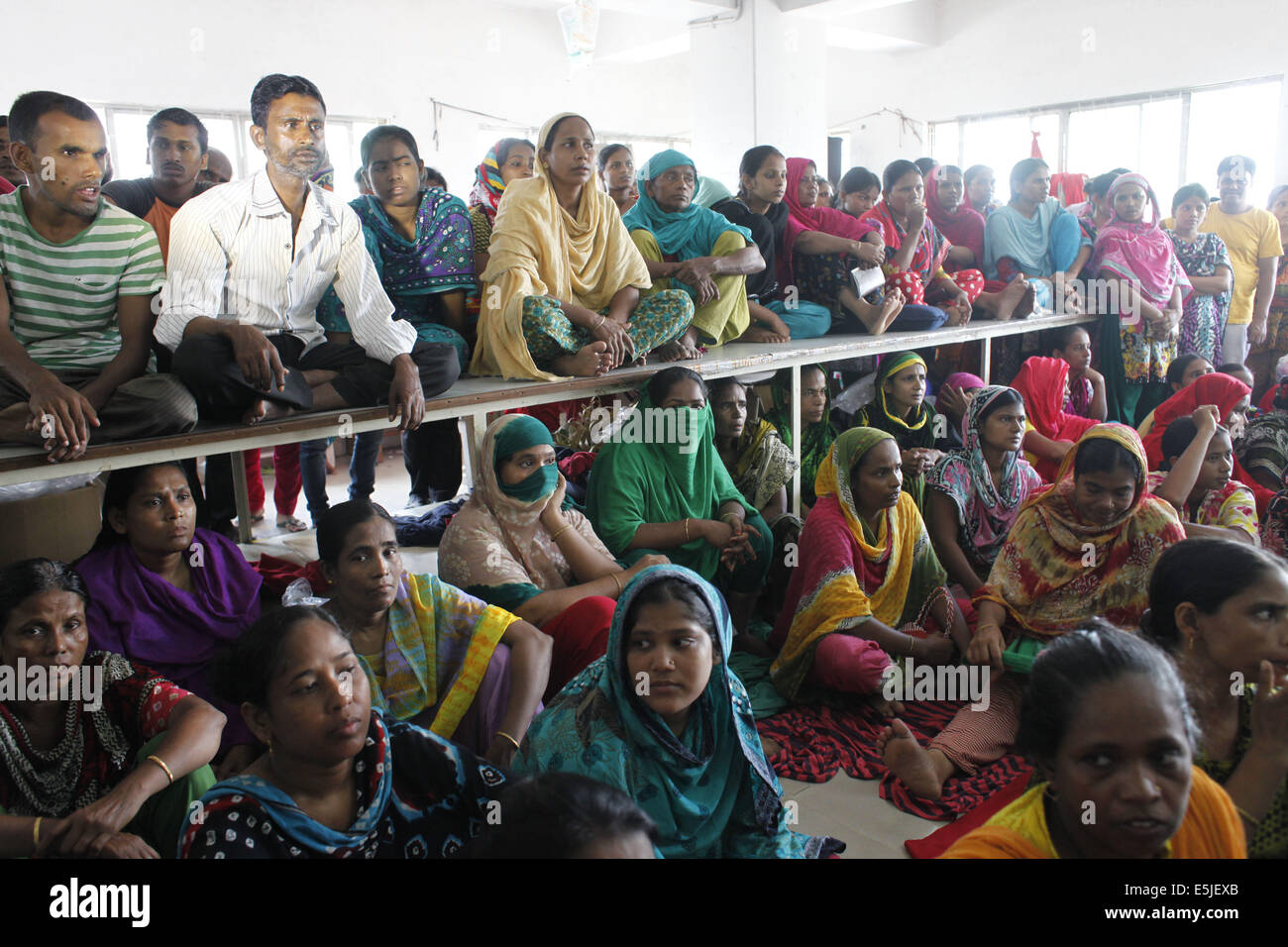 Dhaka, Bangladesh. 2nd Aug, 2014. Inside Tuba garments garments worker's hunger strike on 6th day.Bangladesh garment workers from the Tuba Group shout slogans as they protest unpaid salaries. Garment workers for the Tuba Group on the sixth day of a hunger strike are demanding three months unpaid salaries and Eid bonus Credit:  Zakir Hossain Chowdhury/ZUMA Wire/Alamy Live News Stock Photo