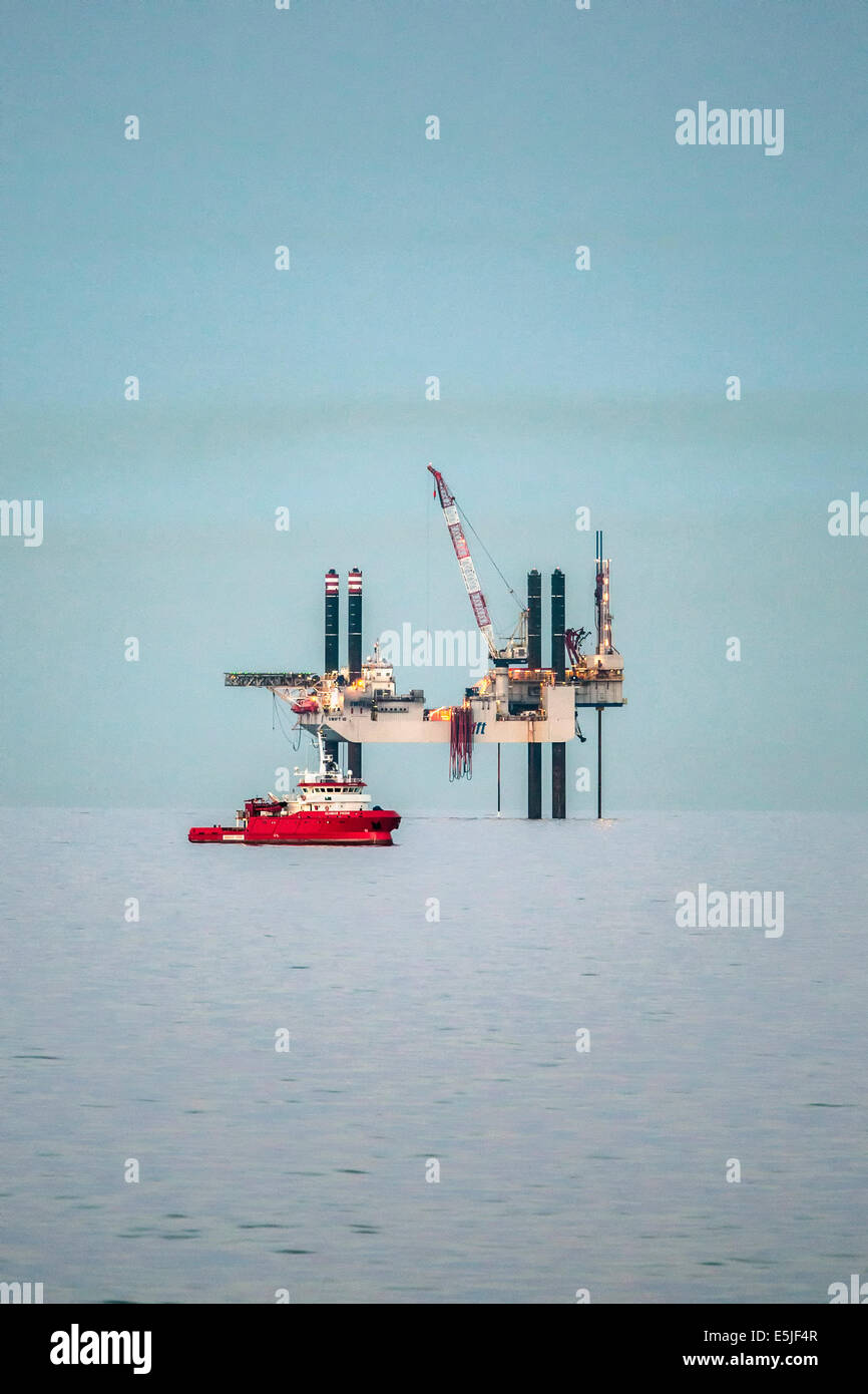 Netherlands, Den Helder, Dutch economic zone on North Sea. Offshore drilling platform SWIFT 10. Foreground offshore supply ship Stock Photo