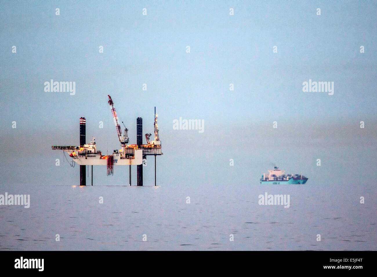 Netherlands, Den Helder, Dutch economic zone on North Sea. Offshore drilling platform SWIFT 10. Foreground offshore supply ship Stock Photo