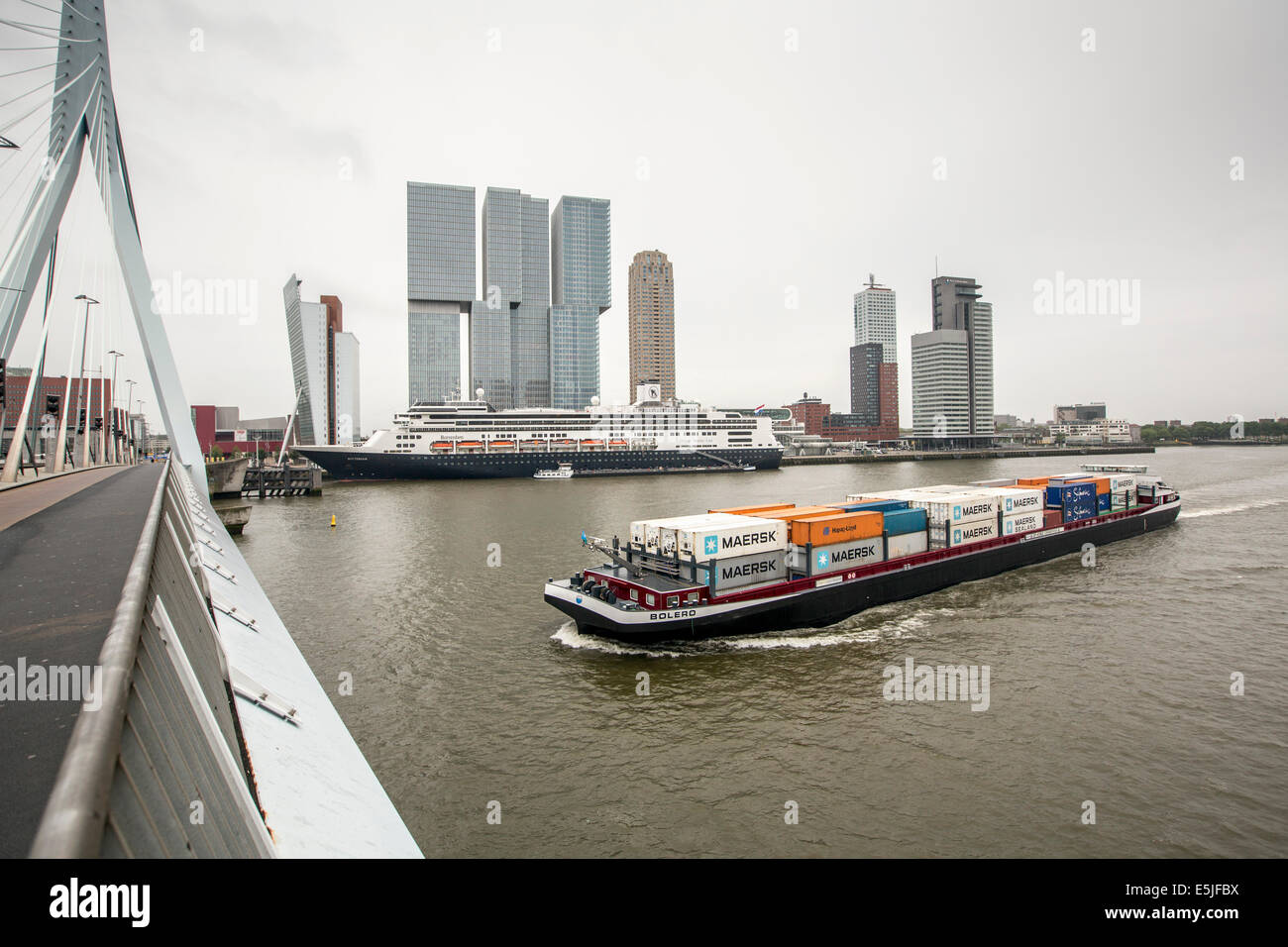 Holland, Rotterdam, Kop van Zuid District, cruise terminal, highrise buildings. Cruise ship MS Rotterdam moored. Container ship Stock Photo
