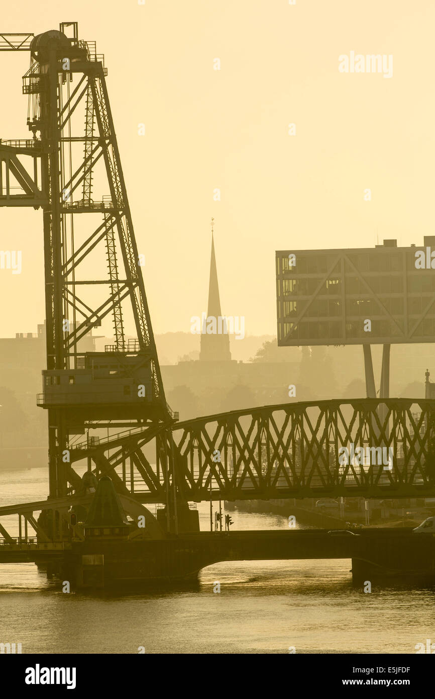Netherlands, Rotterdam, Part of bridge called De Hef. Right part of Unilever Netherlands Headquarters. Sunrise Stock Photo