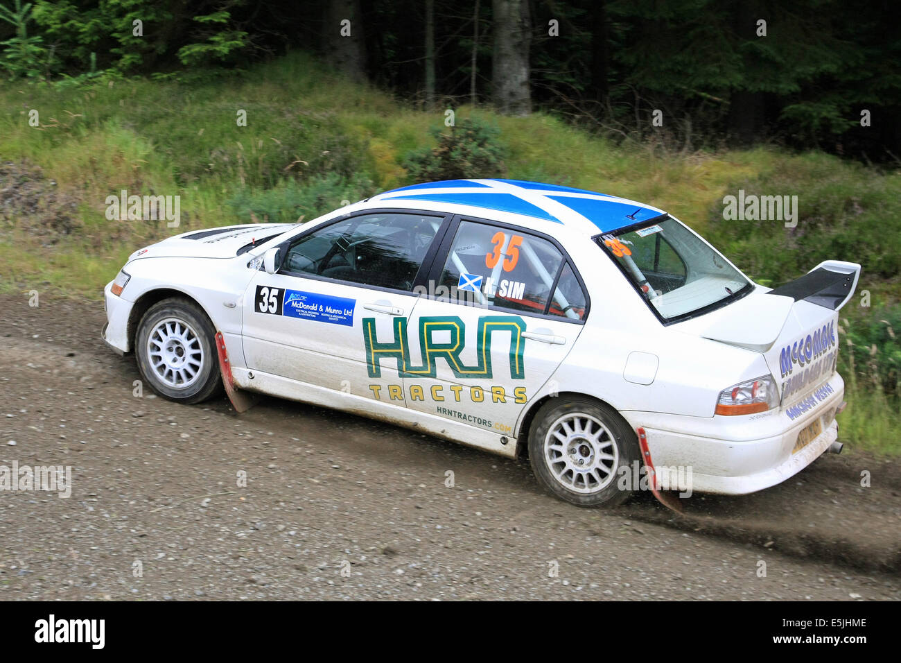 Scotland, UK. 2nd Aug, 2014. Scott McCombie and Kevin Sim in their Mitsubishi Lancer EVO 8 on the Gartly Moor stage of the Speyside Stages Rally, Scotland. Saturday 2nd August 2014. Credit:  Malcolm Gallon/Alamy Live News Stock Photo