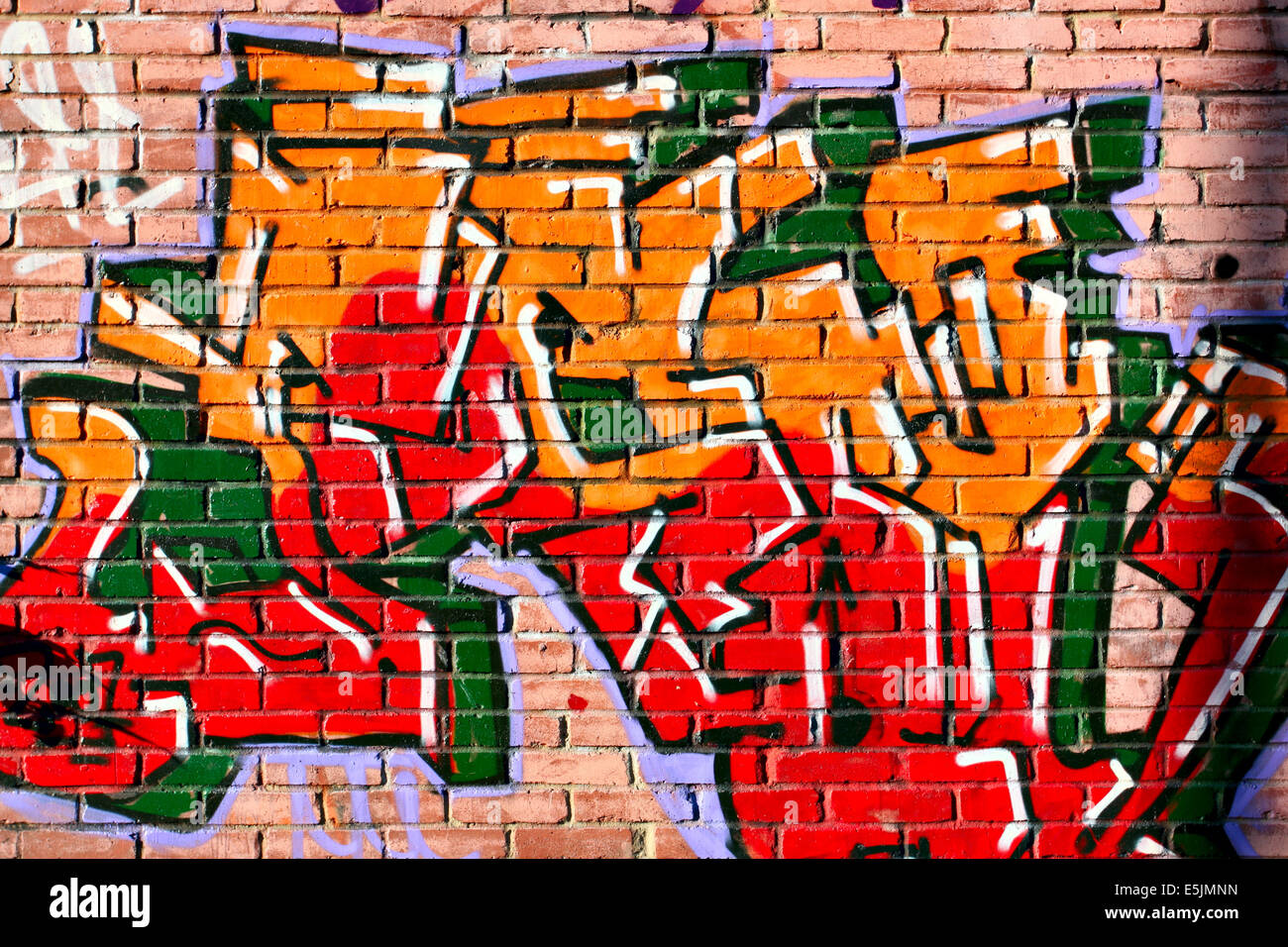 Urban graffiti over bricks wall close-up Stock Photo