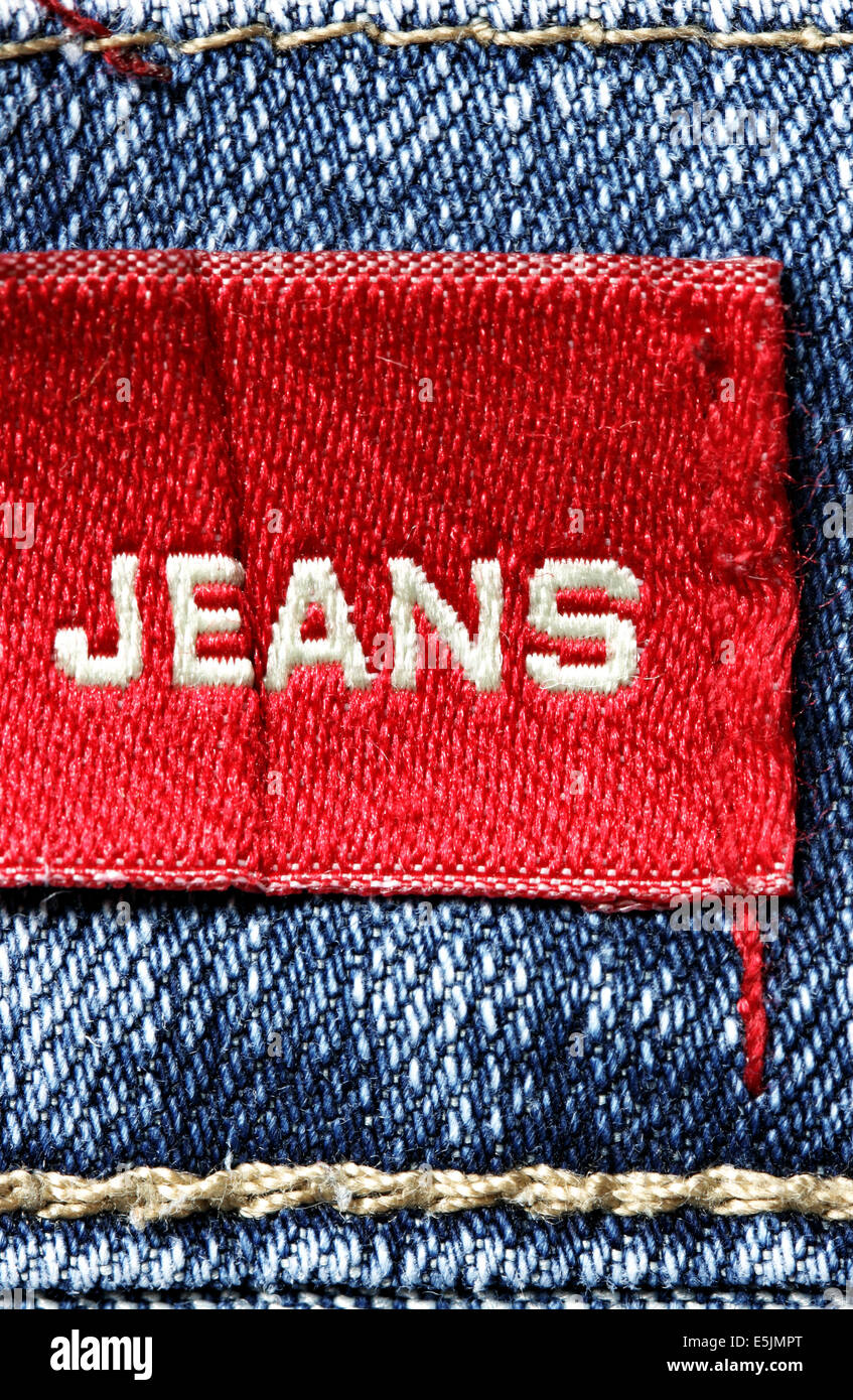 Blue jeans and red label with word Jeans Stock Photo Alamy