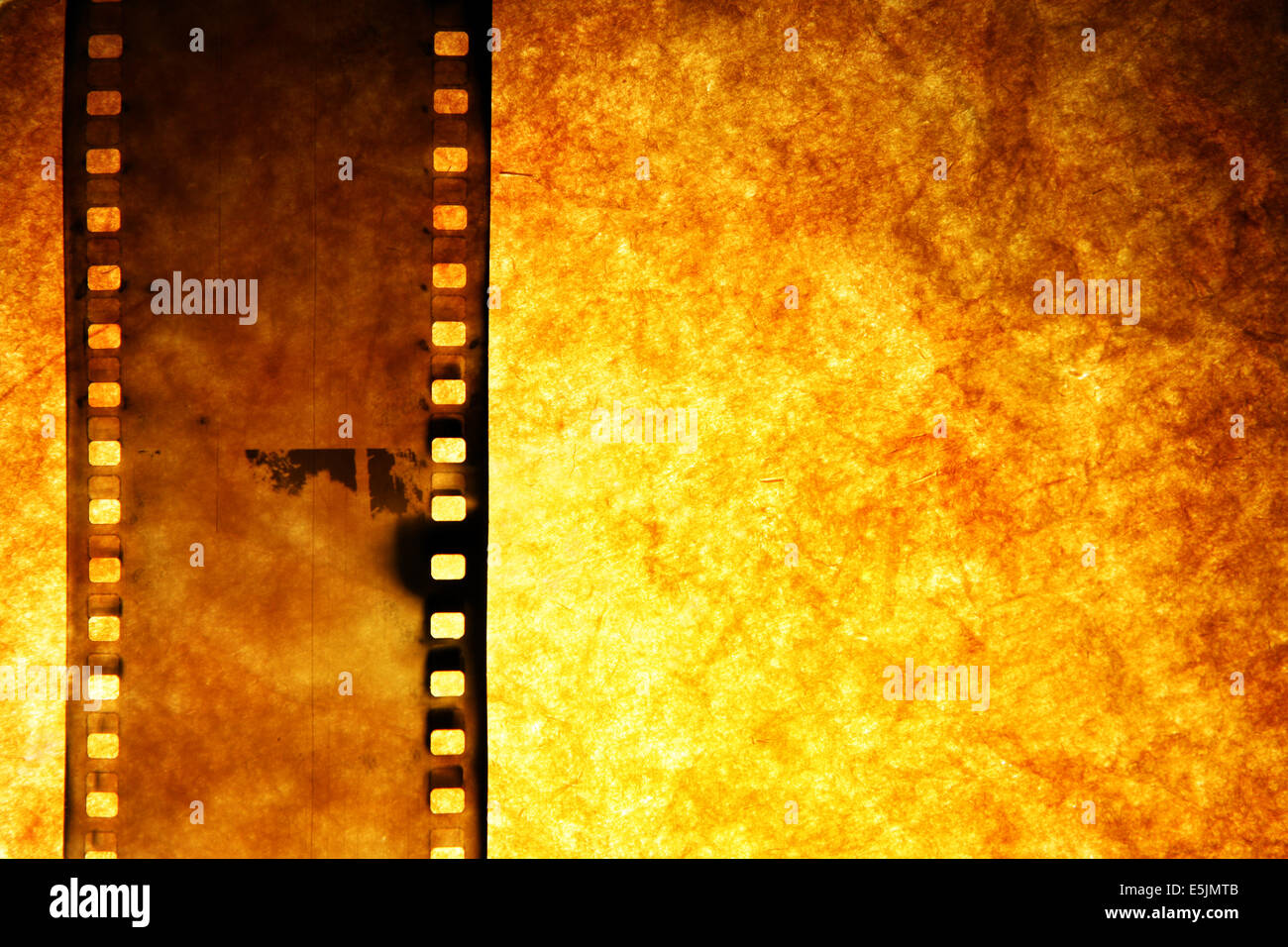 Old film strip over grunge paper background Stock Photo