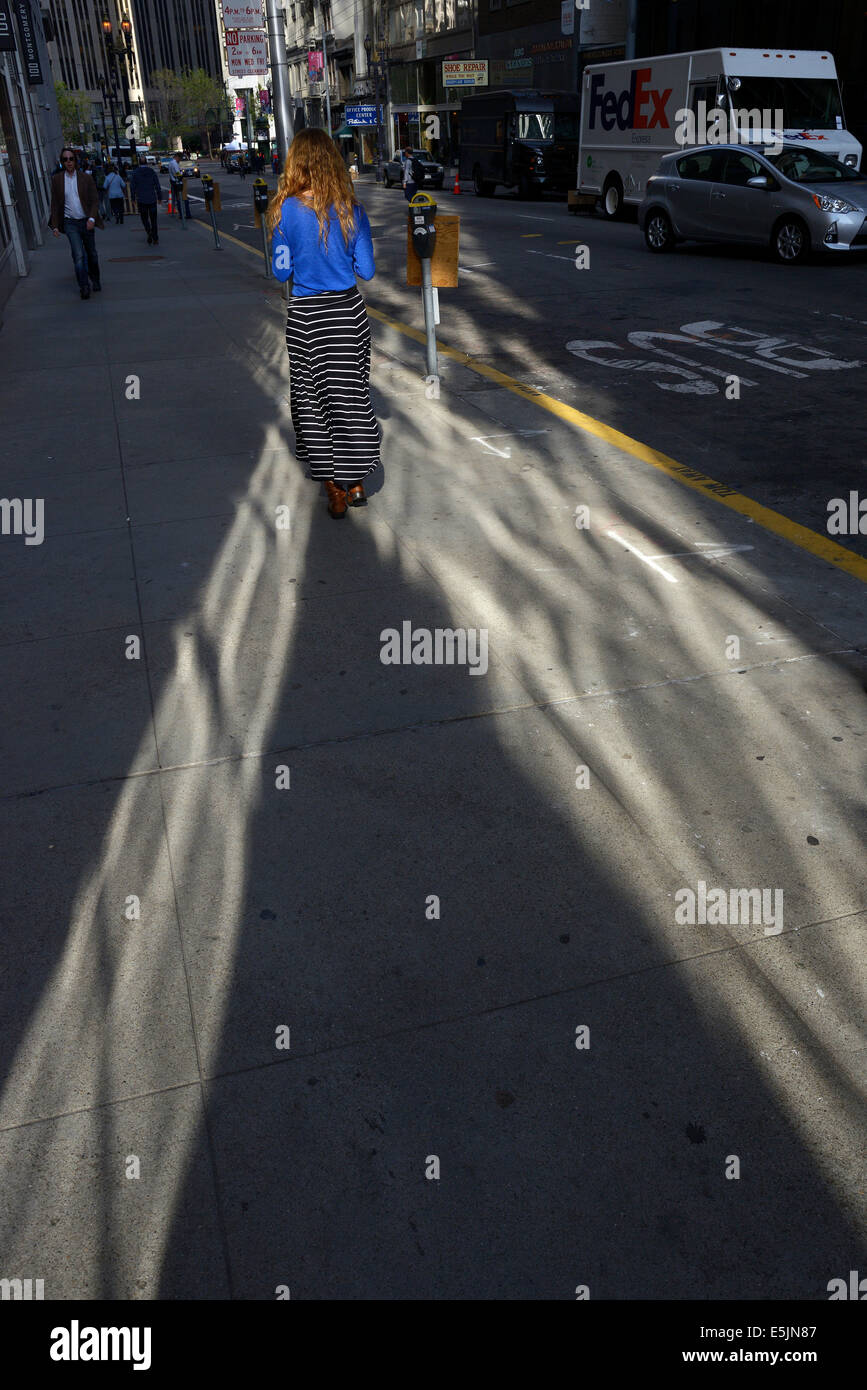 woman walks san francisco downtown sidewalk Stock Photo