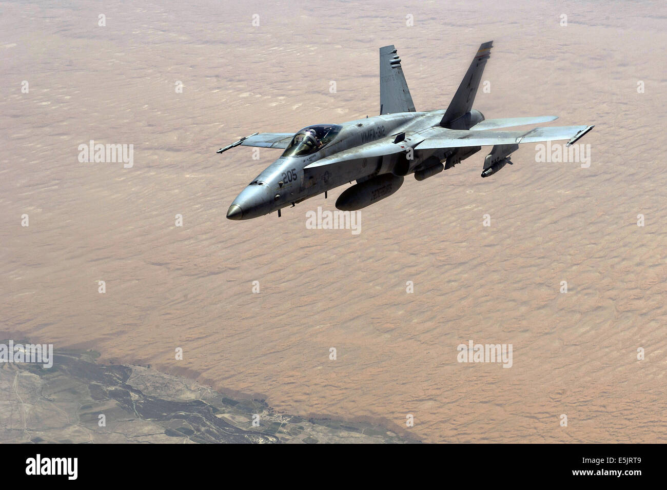 A US Navy F/A-18C Hornet fighter aircraft during a mission over Afghanistan Sept. 4, 2013, over Afghanistan. Stock Photo