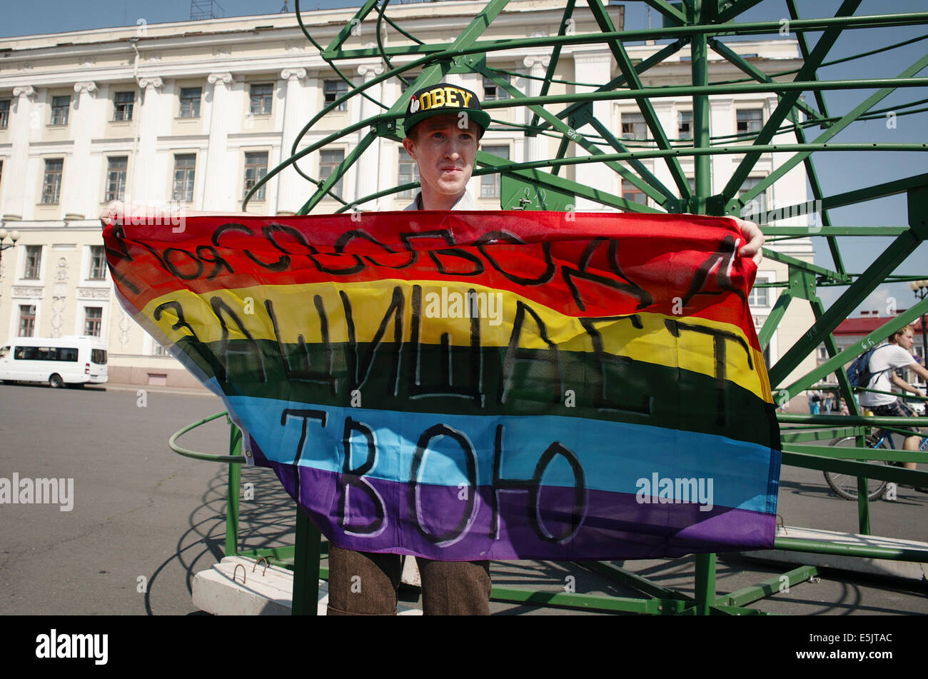 St Petersburg, Russia. 2nd Aug, 2014. LGBT gay activist KIRILL KALUGIN during a one-man protest in Palace Square. The signs on the flag reads 'My freedom protects yours.' Credit:  Denis Tarasov/ZUMA Wire/ZUMAPRESS.com/Alamy Live News Stock Photo