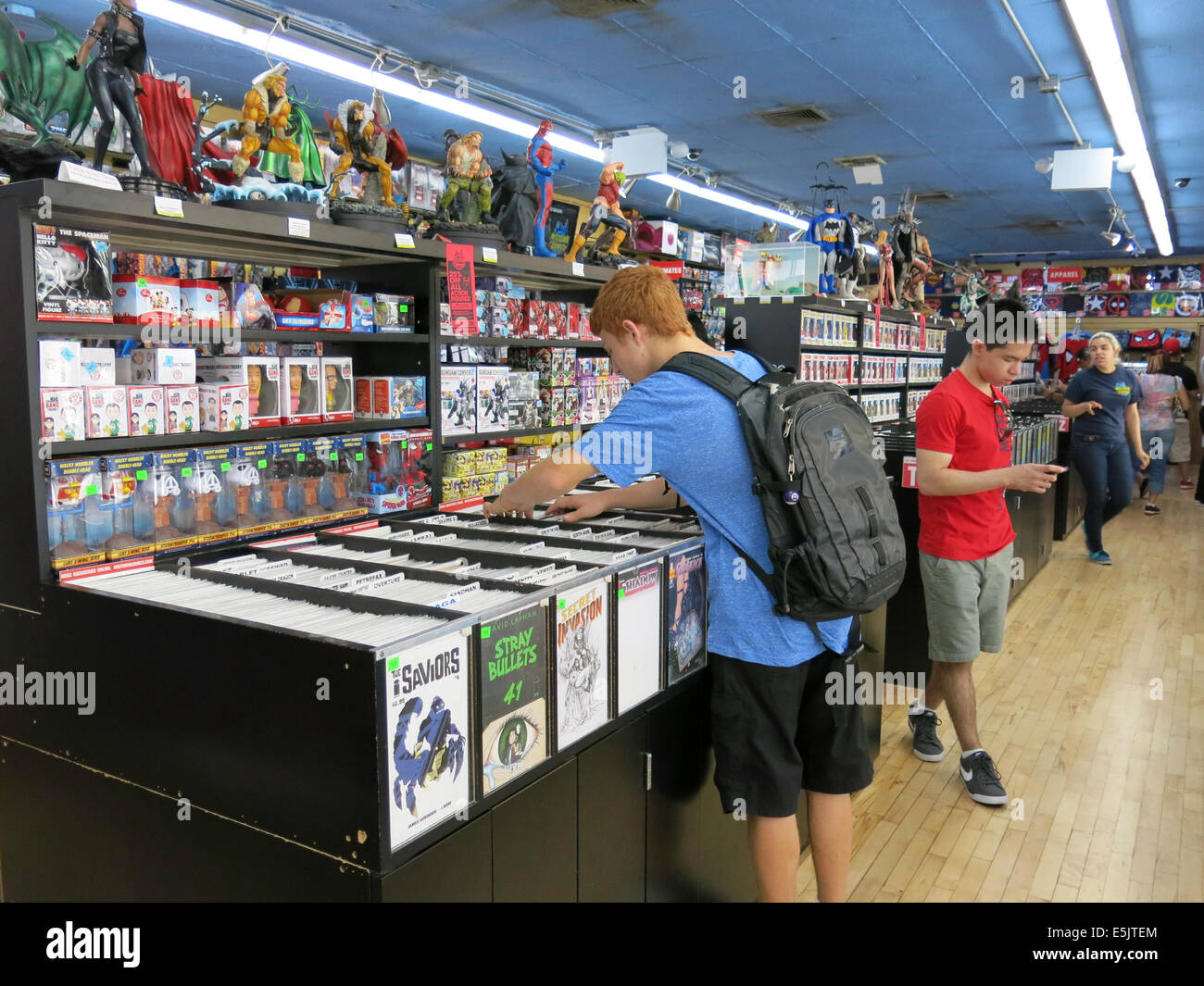 Shoppers in Midtown Comics Store, Times Square, NYC, USA Stock Photo