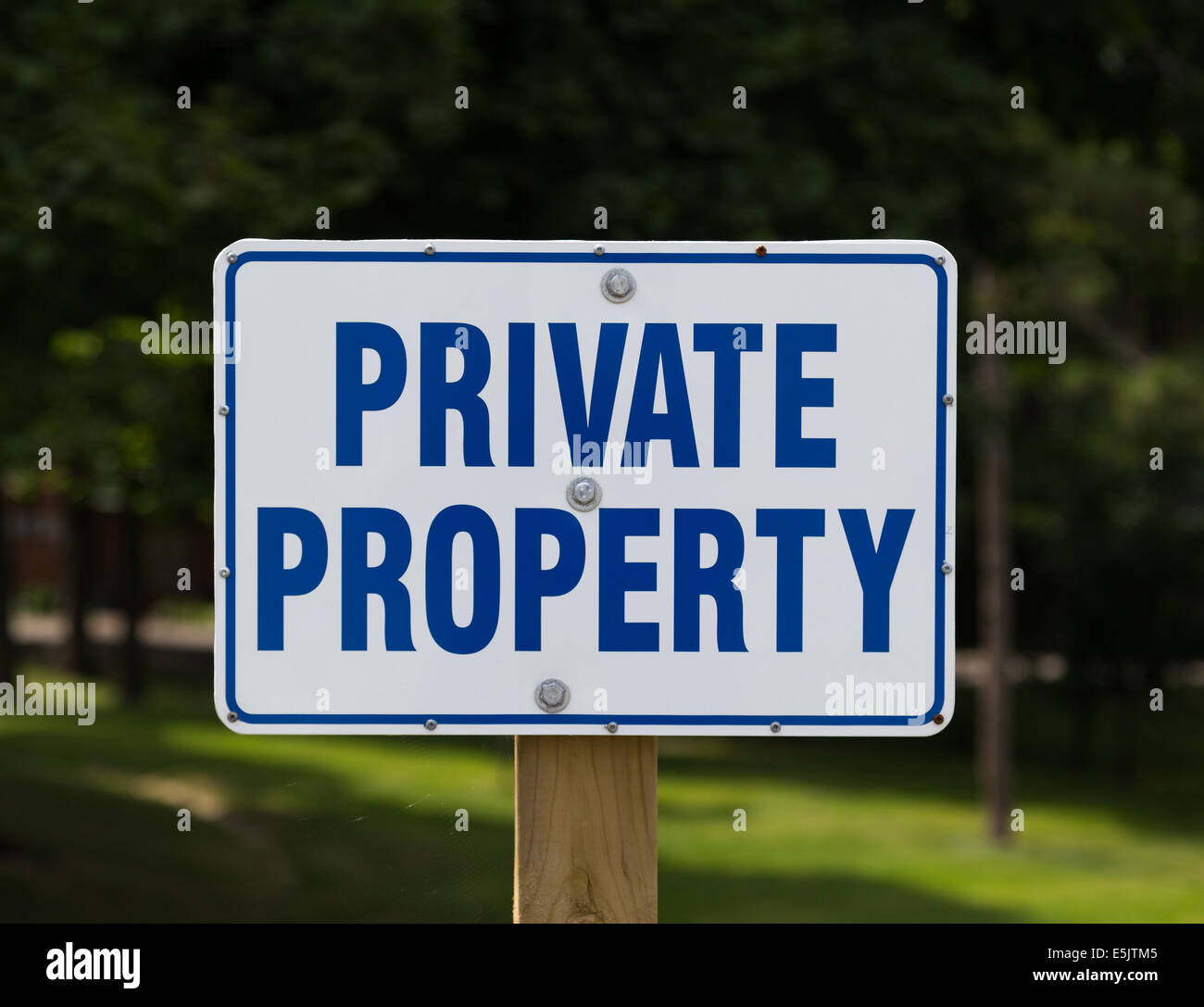 Closeup to a Private Property Sign during the day Stock Photo