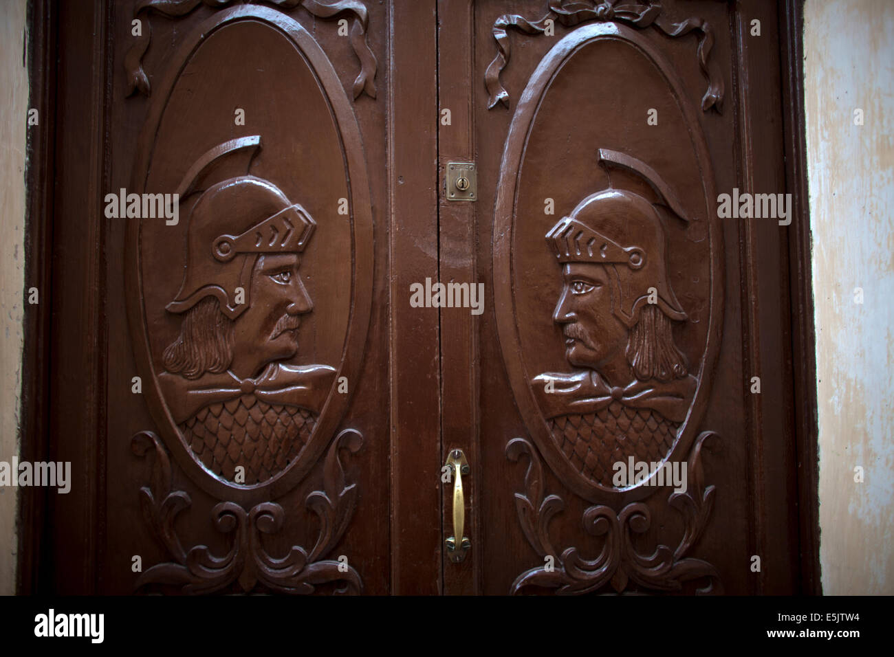 A door decorated with two Roman legionaries in a house in Caceres, Extremadura, Spain, April 15, 2014. Stock Photo