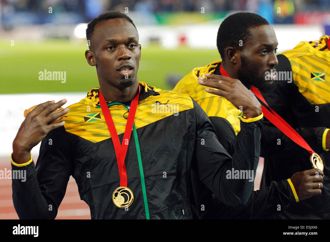 Hampden Park, Glasgow, Scotland, UK, Saturday, 2nd August, 2014. Glasgow 2014 Commonwealth Games, Men's 4 x 100m Relay, Medal Ceremony. Left to Right. Usain Bolt and Nickel Ashmeade, Jamaica, with their Gold Medals Stock Photo