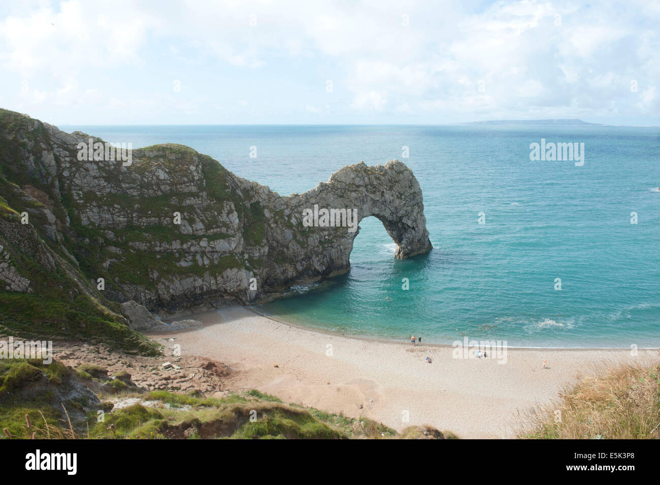 Durdle Door (sometimes written Durdle Dor) is a natural limestone arch on the Jurassic Coast near Lulworth in Dorset, England Stock Photo