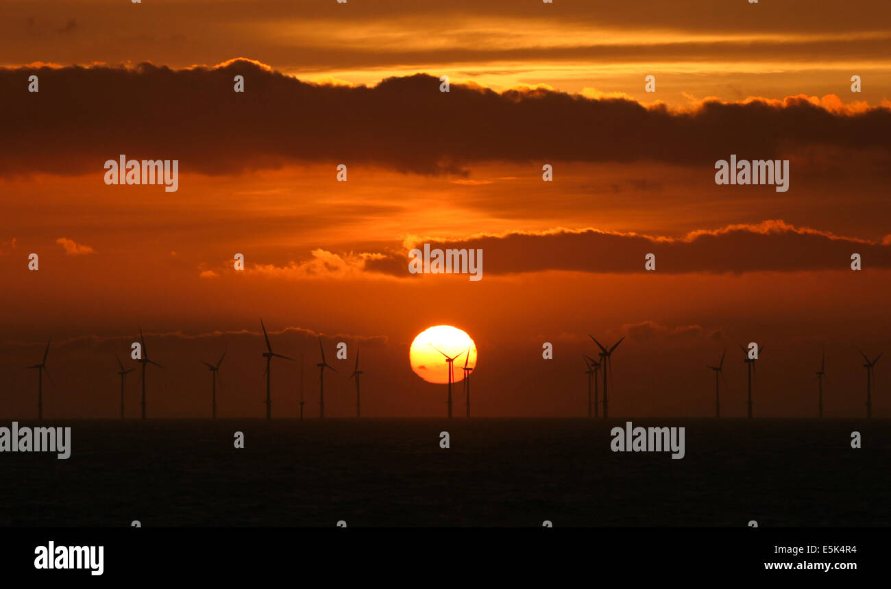 Sunrise over the North Hoyle Offshore Wind Farm off the coast of North Wales during spring 2014 Stock Photo