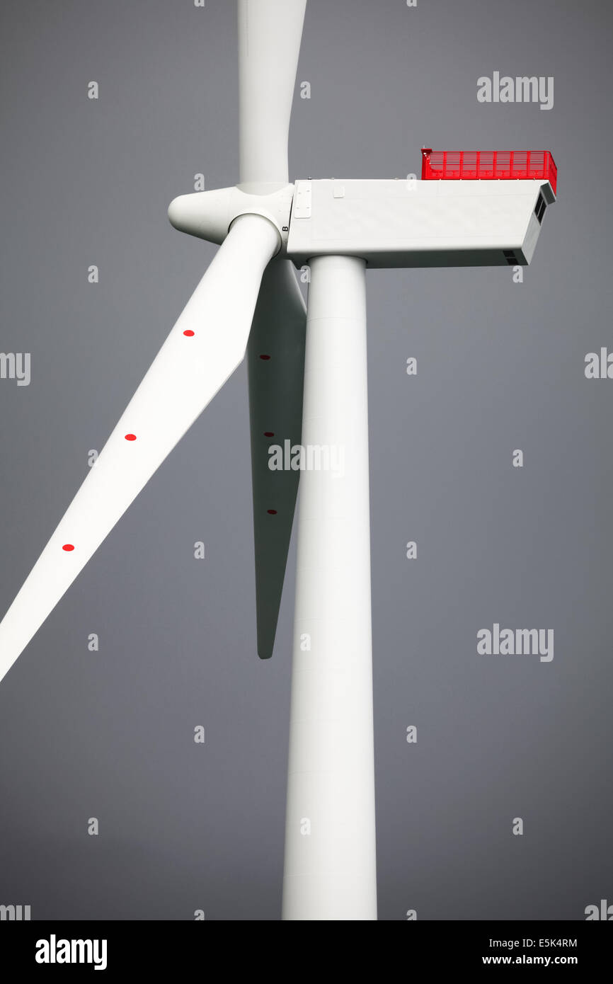 A colour photo of dark clouds behind a turbine on Gwynt y Mor Offshore Wind Farm Stock Photo