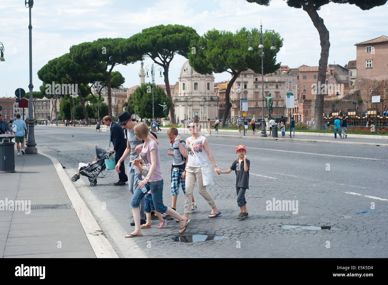 Rome, Italy 2014 - Family crossing street Stock Photo
