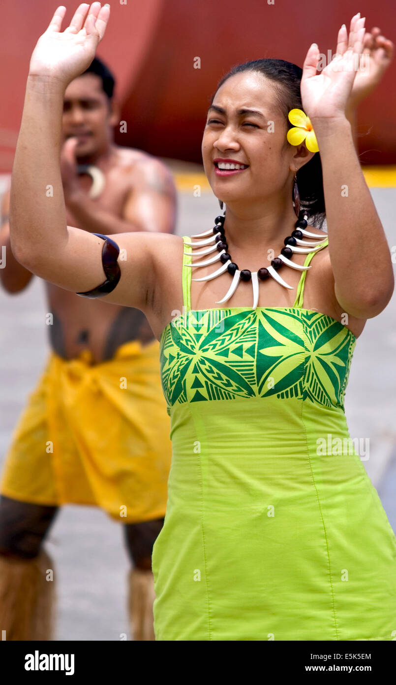 Female Polynesian dancer in traditional costume performing during a performance in Apia, Samoa. Stock Photo