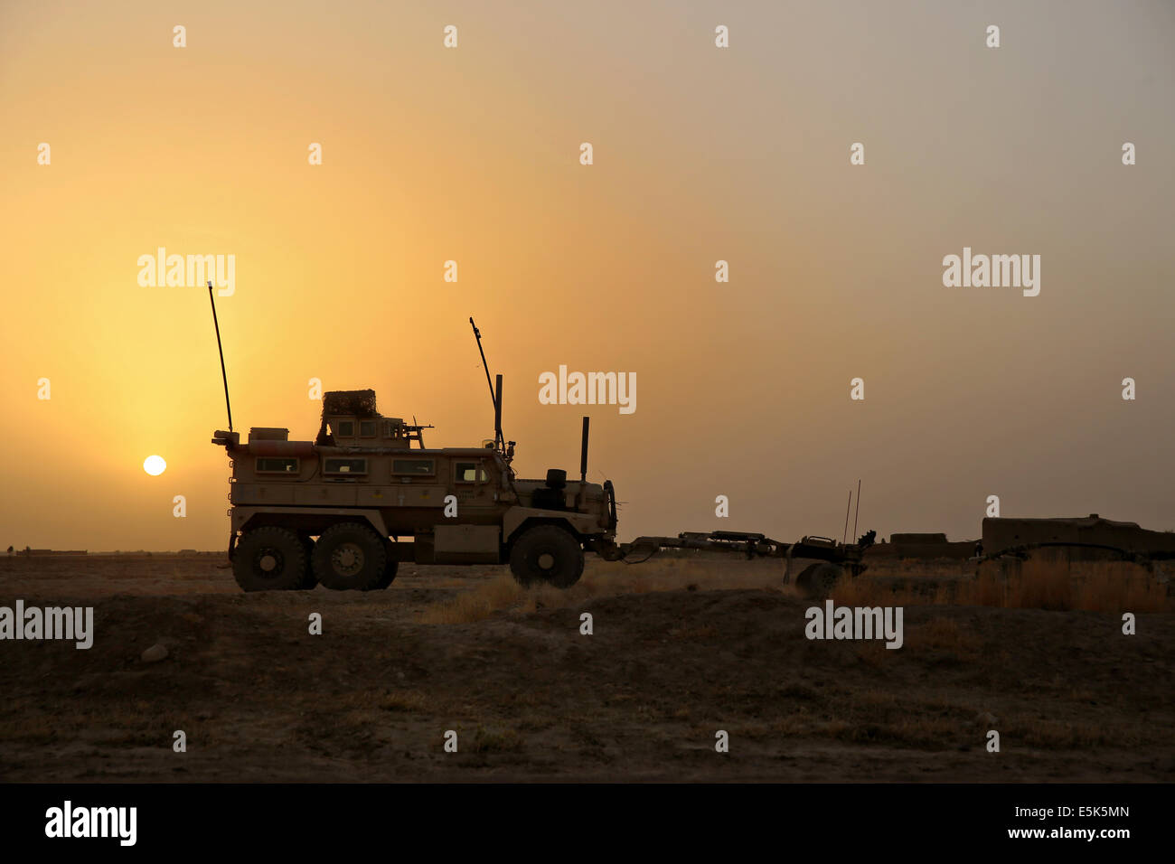 US Marines with the 1st Battalion, 7th Marine Regiment patrol in a Mine-Resistant Ambush-Protected vehicle during a mission at sunset July 5, 2014 in Gereshk, Helmand province, Afghanistan. Stock Photo