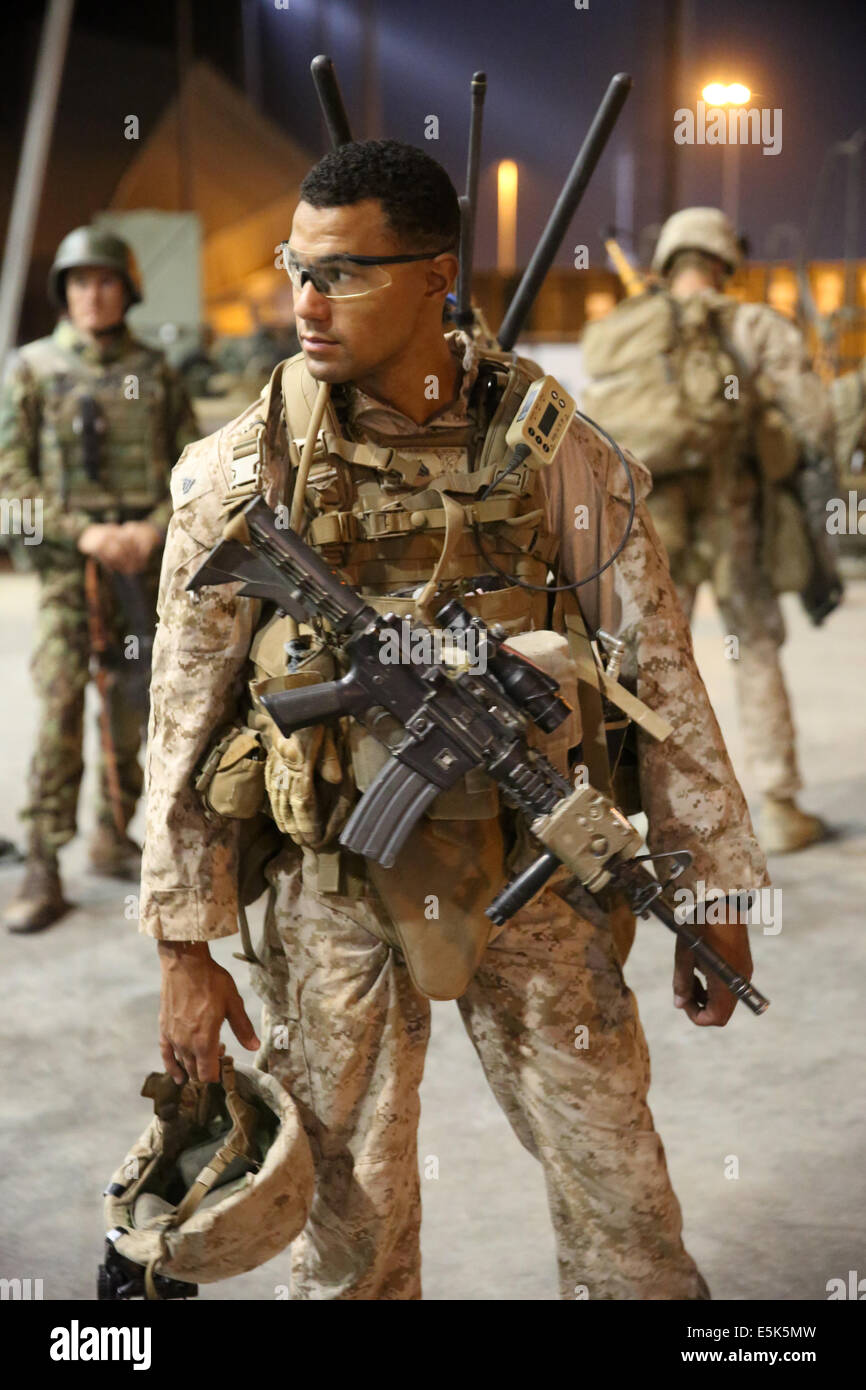 US Marines with the 1st Battalion, 7th Marine Regiment prepare to depart on a patrol July 4, 2014  in Gereshk,  Helmand province, Afghanistan. Stock Photo