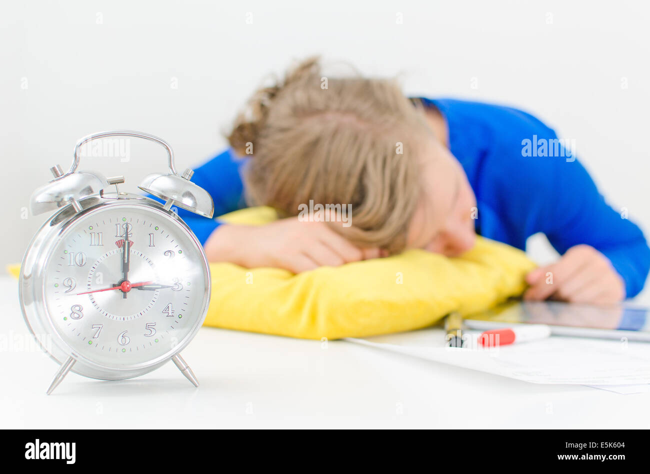 Schedule of the day. Workday. Woman fell asleep on the table. Stock Photo