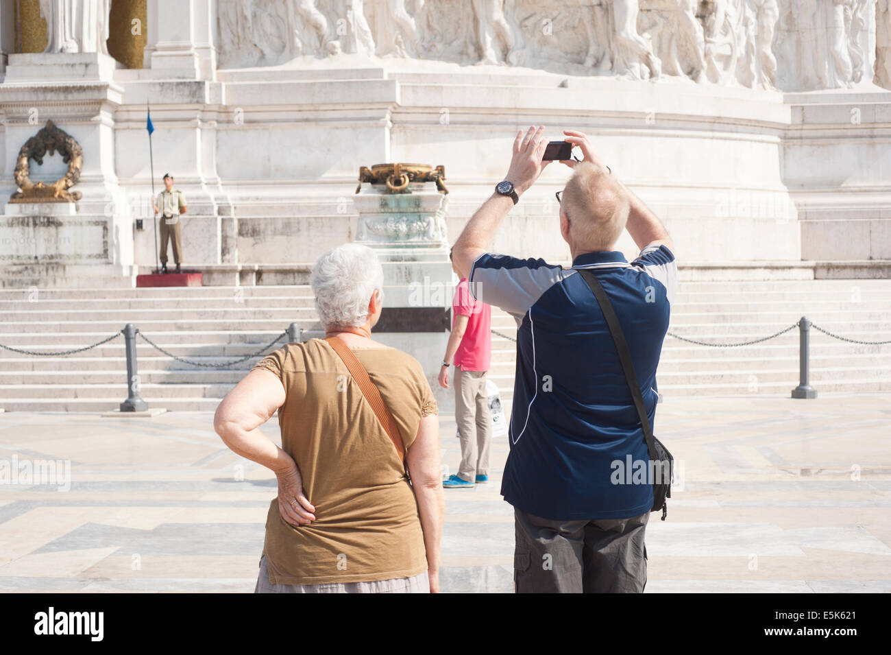 Rome Italy - A couple of senior tourists taking photos at the Altar of the Fatherland Stock Photo