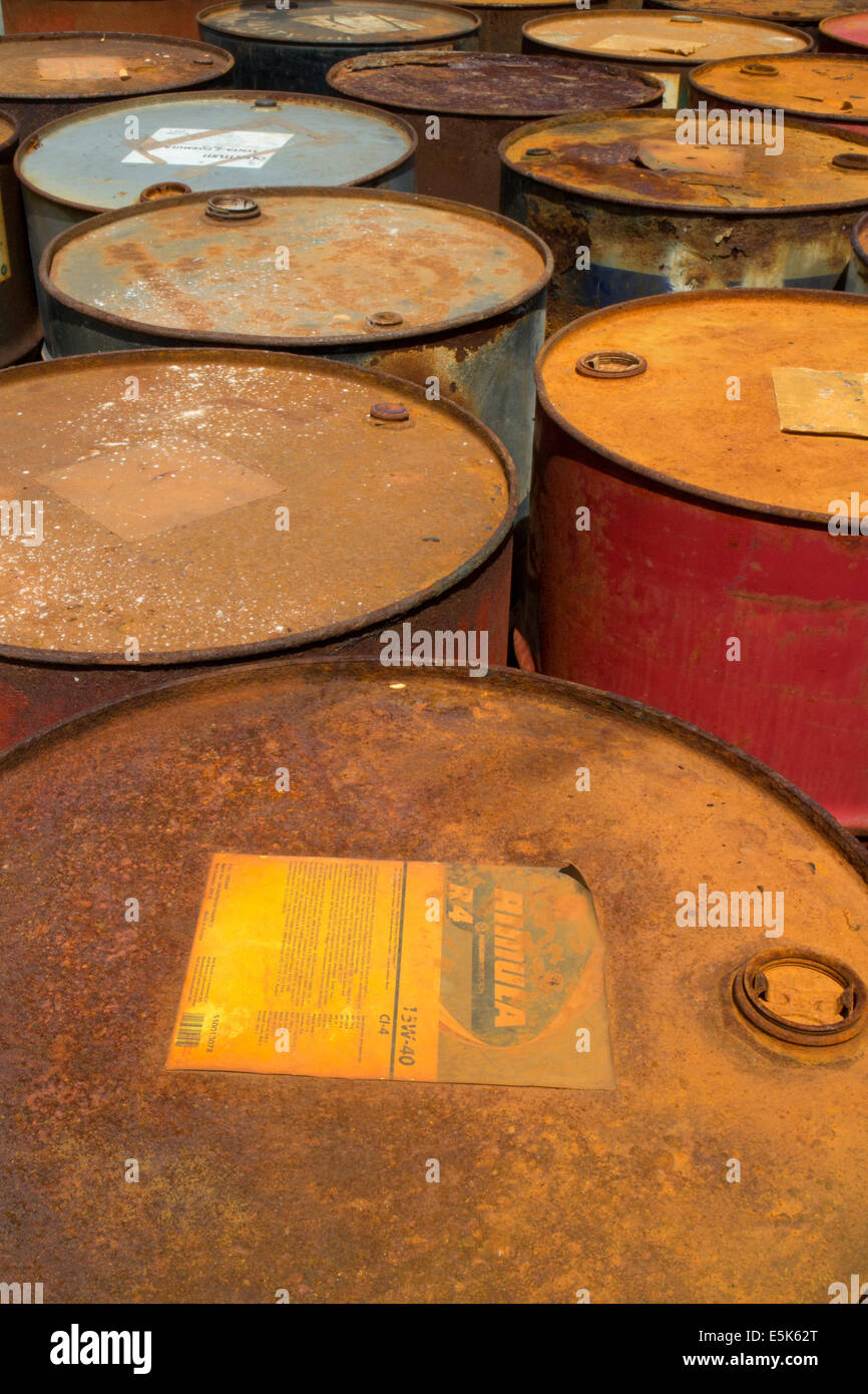 Oil drums alongside a harbour Stock Photo
