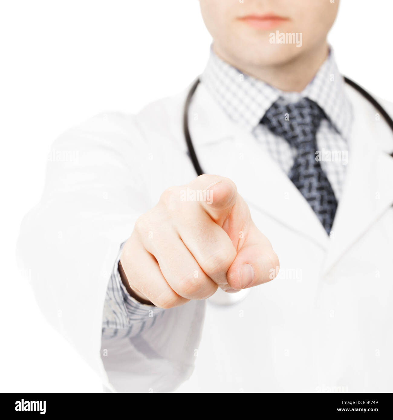 Young medical doctor pointing on viewer with index finger of his right ...