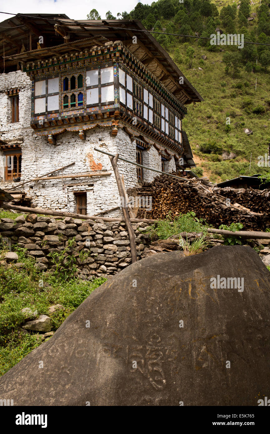 Eastern Bhutan, Lhuentse Valley, Khoma village, mani stone outside farmhouse Stock Photo