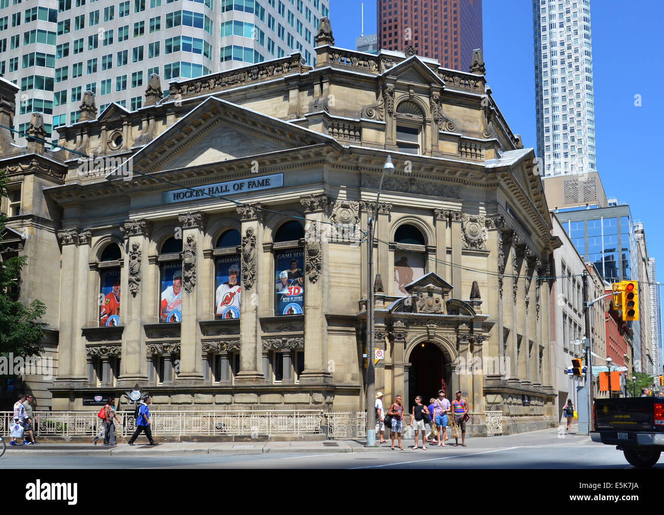 TORONTO - JUNE 27: Tourists stand outside the Hockey Hall of Fame on June 27, 2014. The Hall of Fame is the home of the Stanley Stock Photo