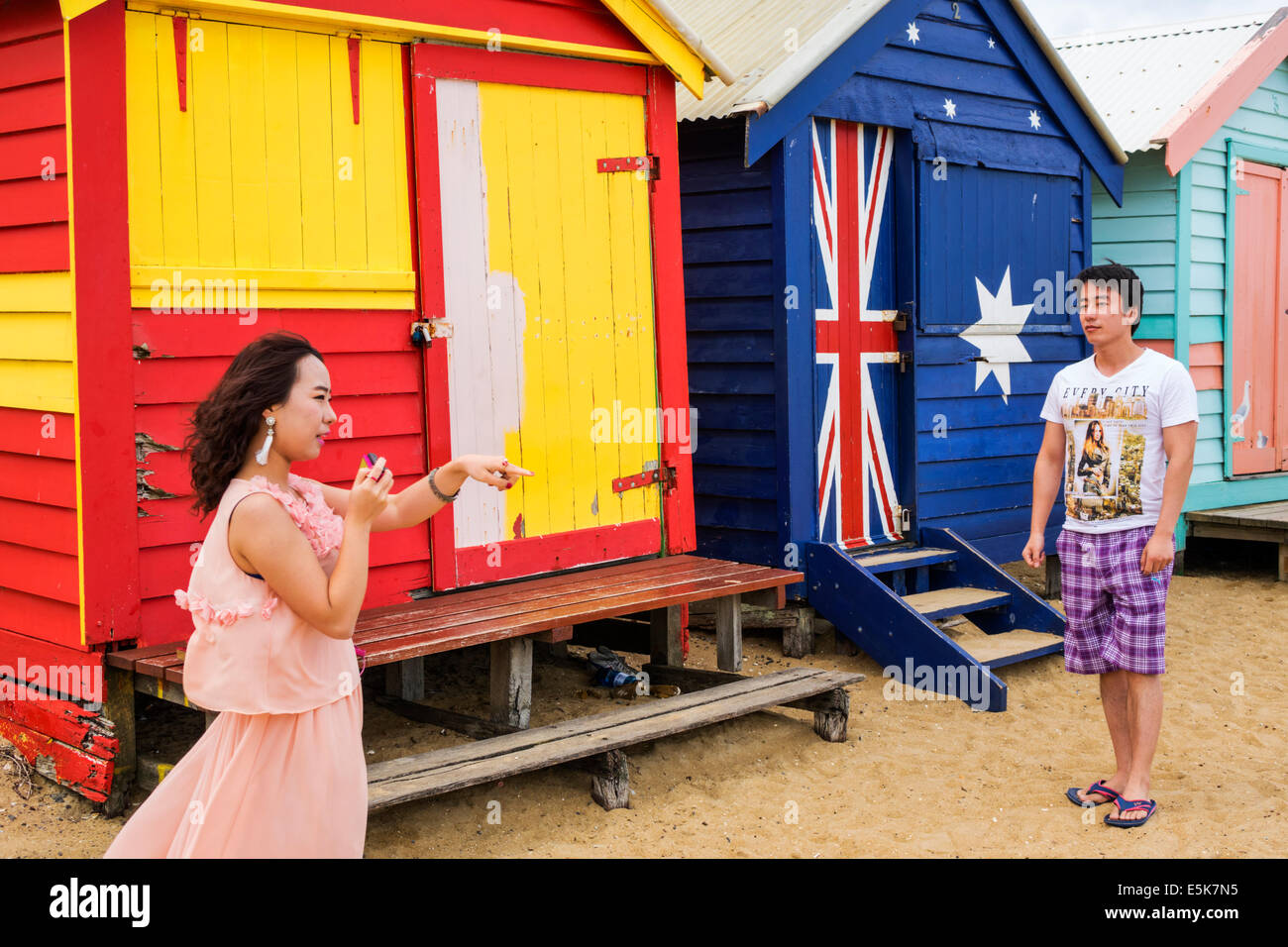 Melbourne Australia,Victoria Brighton Beach,bathing boxes,huts,cabins,colorful,Asian Asians ethnic immigrant immigrants minority,adult adults man men Stock Photo