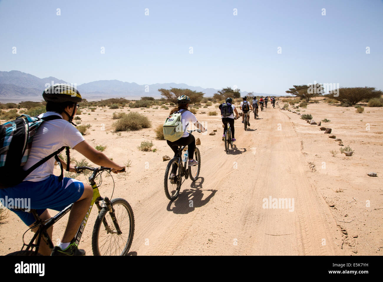 A group of bicycle riders in the Arava desert Israel Stock Photo