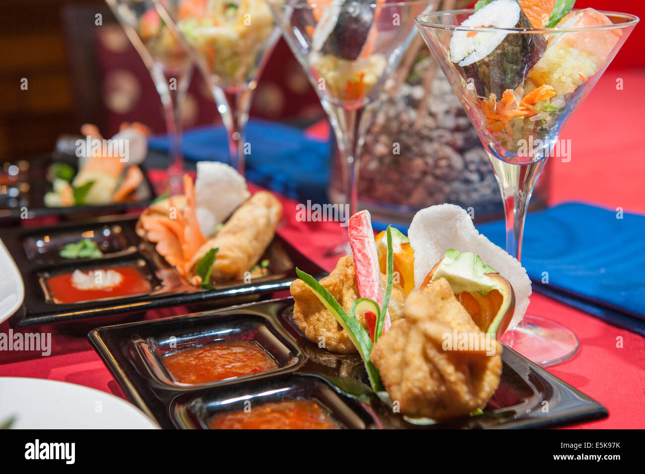 Various selection of chinese appetizers on table in restaurant Stock