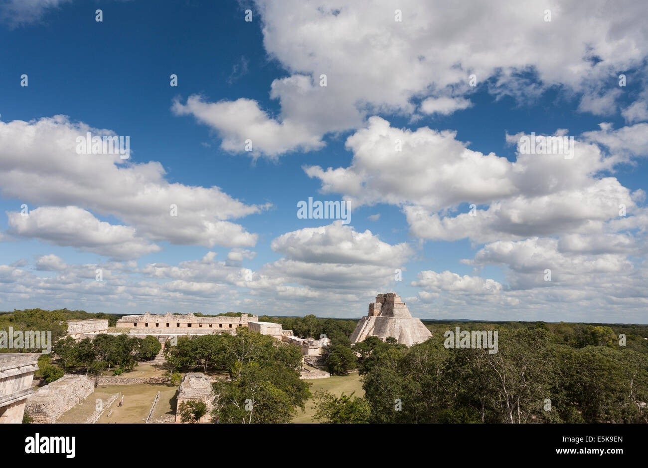 Uxmal's Mayan Pyramid of the Magician rising through the treetops dominates the archaeological zone. Stock Photo
