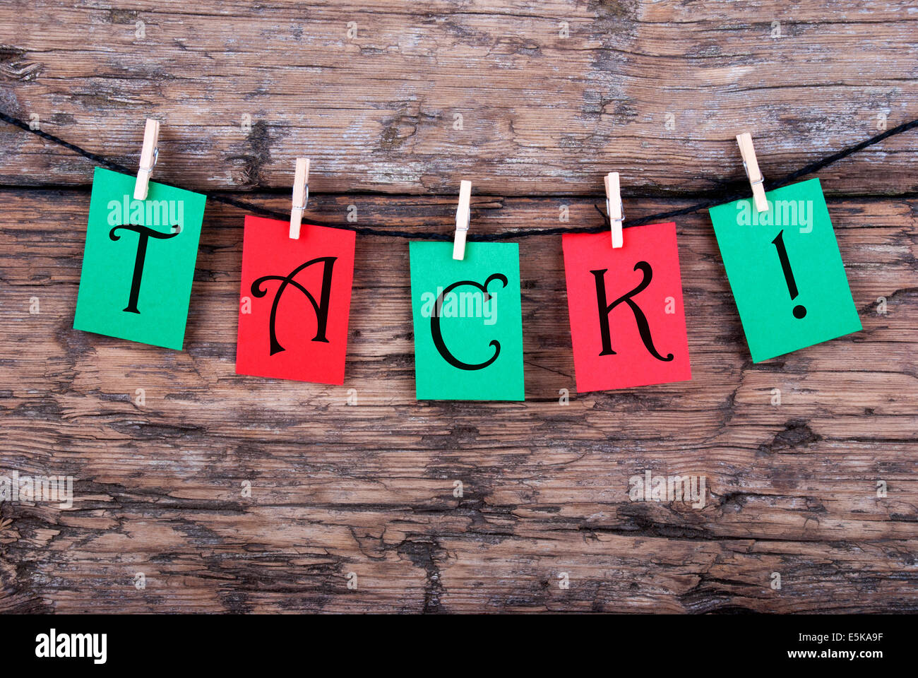 The Swedish Word Tack, which means Thanks, on red and green Labels