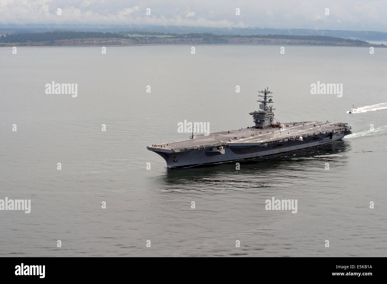 US Navy nuclear aircraft carrier USS Nimitz cruises in the Strait of Juan de Fuca during family day June 13, 2014 off the Olympic Peninsula, Washington. Stock Photo