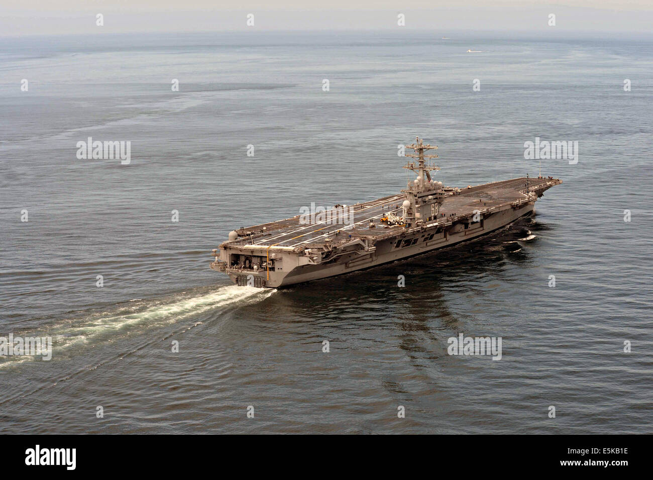 US Navy nuclear aircraft carrier USS Nimitz cruises in the Strait of Juan de Fuca during family day June 13, 2014 off the Olympic Peninsula, Washington. Stock Photo