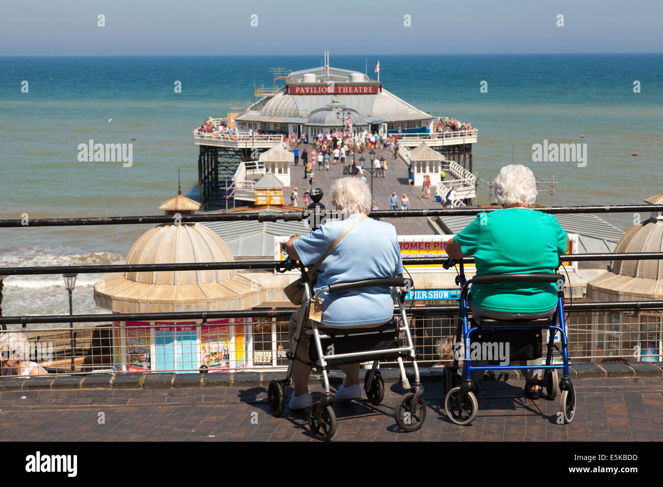 Two elderly ladies resting and enjoying the view at Cromer, Norfolk, England, U.K. Stock Photo