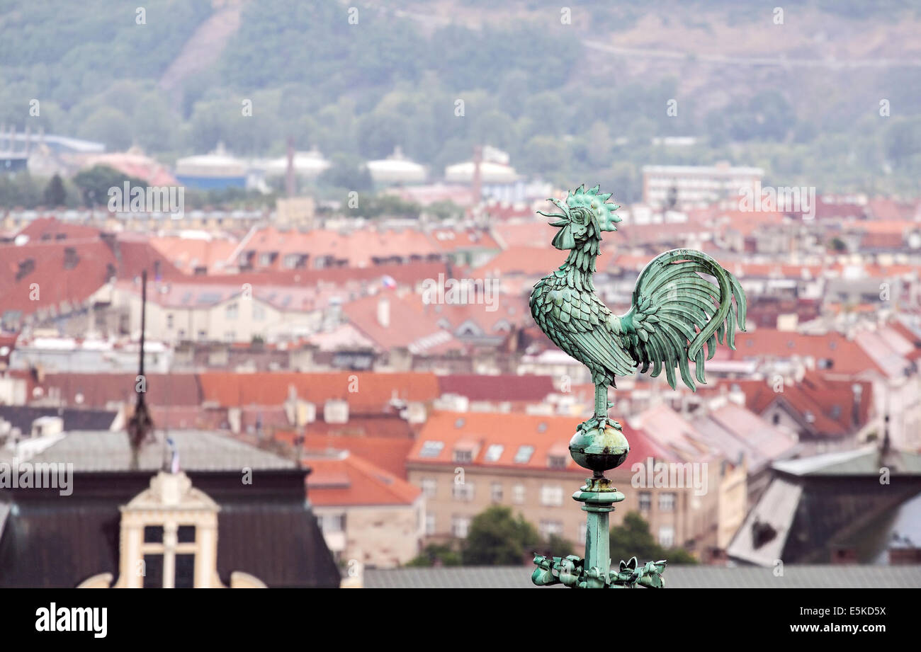 Rooster overlooking Prague roofs Stock Photo