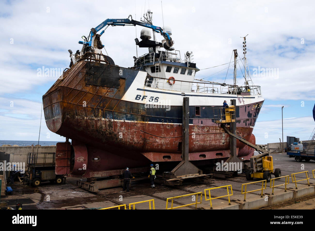 Fishing trawlers under repair at shipyard in Macduff in Aberdeenshire Scotland Stock Photo