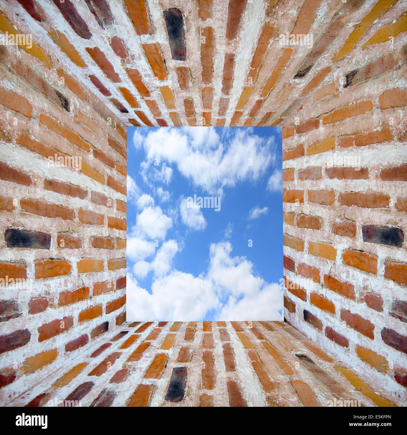 Prison's window in wall from brick and sky Stock Photo