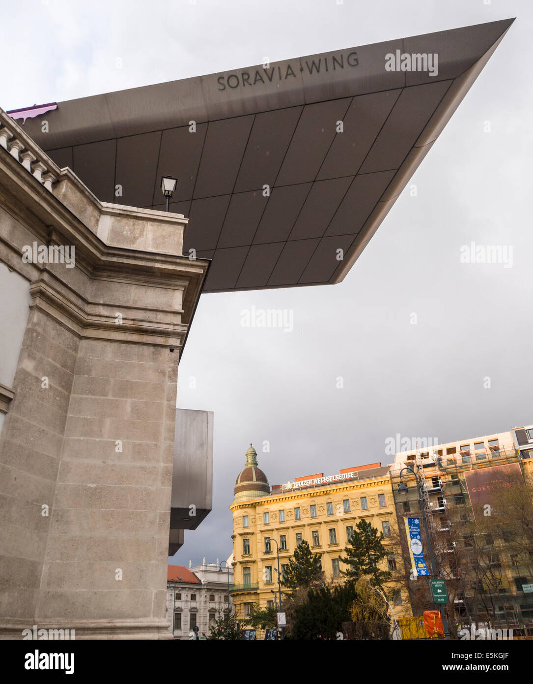 Sorvia Wing of the Albertina Museum . The modern wing flies over the colourful buildings in the square around Albertina Museum Stock Photo
