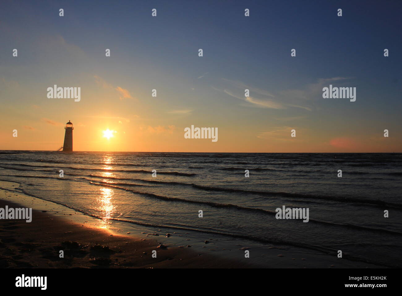 Point of Ayr lighthouse at sunset Stock Photo
