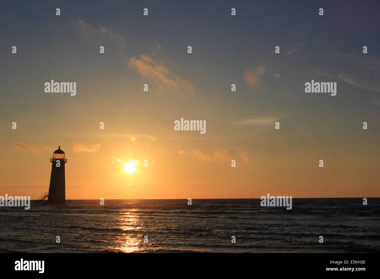 Point of Ayr lighthouse at sunset Stock Photo
