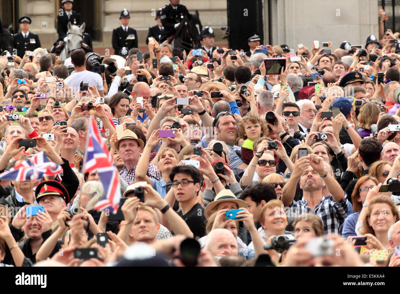 Crowds photographing air display outside Buckingham Palace Stock Photo