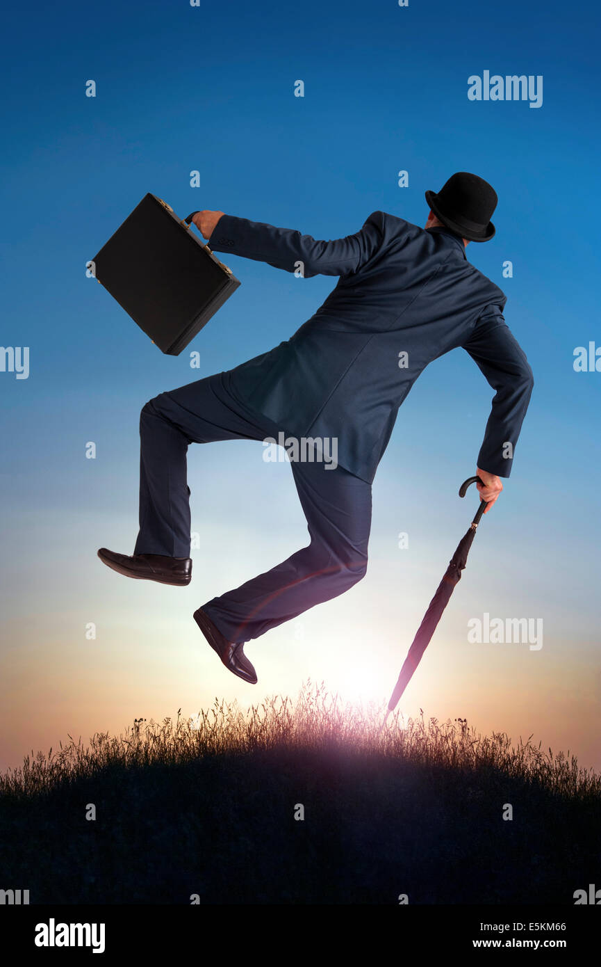 business success concept businessman kicking heels in the air Stock Photo